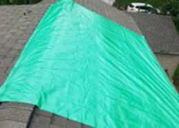 tarp covering damaged roof