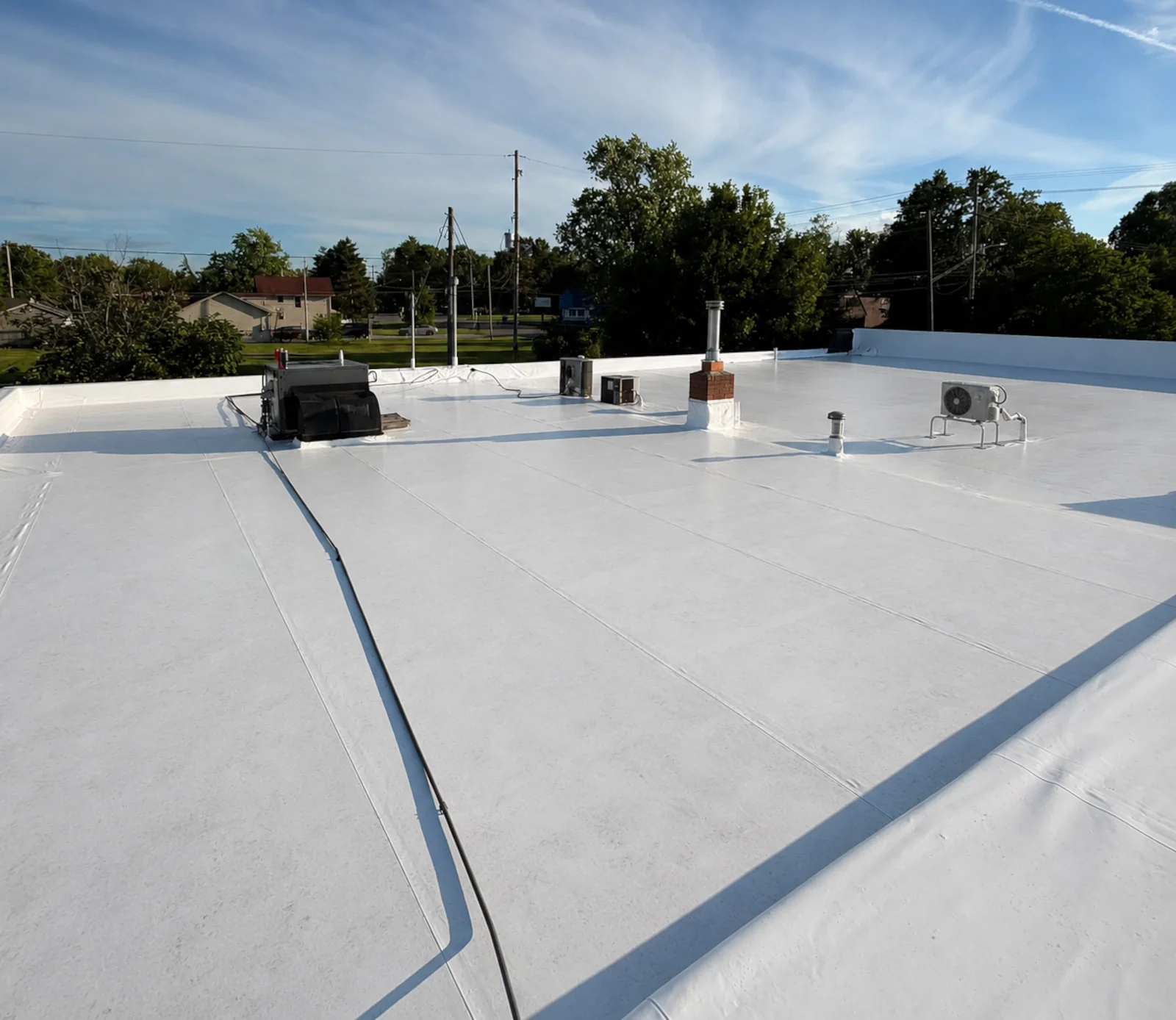 New white duro last pvc commercial roofing membrane installed on a church in Flint Michigan.