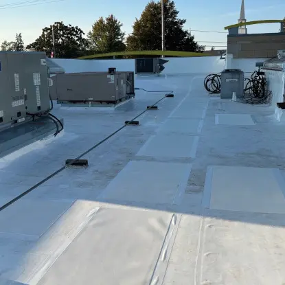 Newly installed duro last pvc flat roof membrane on a commercial roofing in Flushing Michigan.
