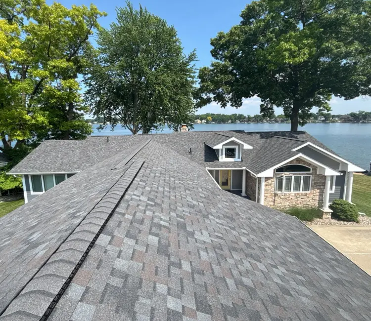 Gray dimensional life-time roofing shingles installed by Michigan roofing contactor.