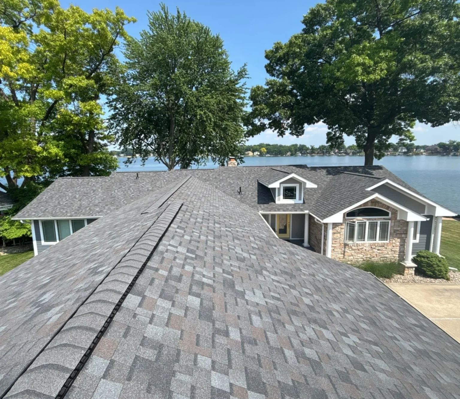 Lake Fenton view from a new shingle roof installed by ideal roofing on home in Fenton Michigan.