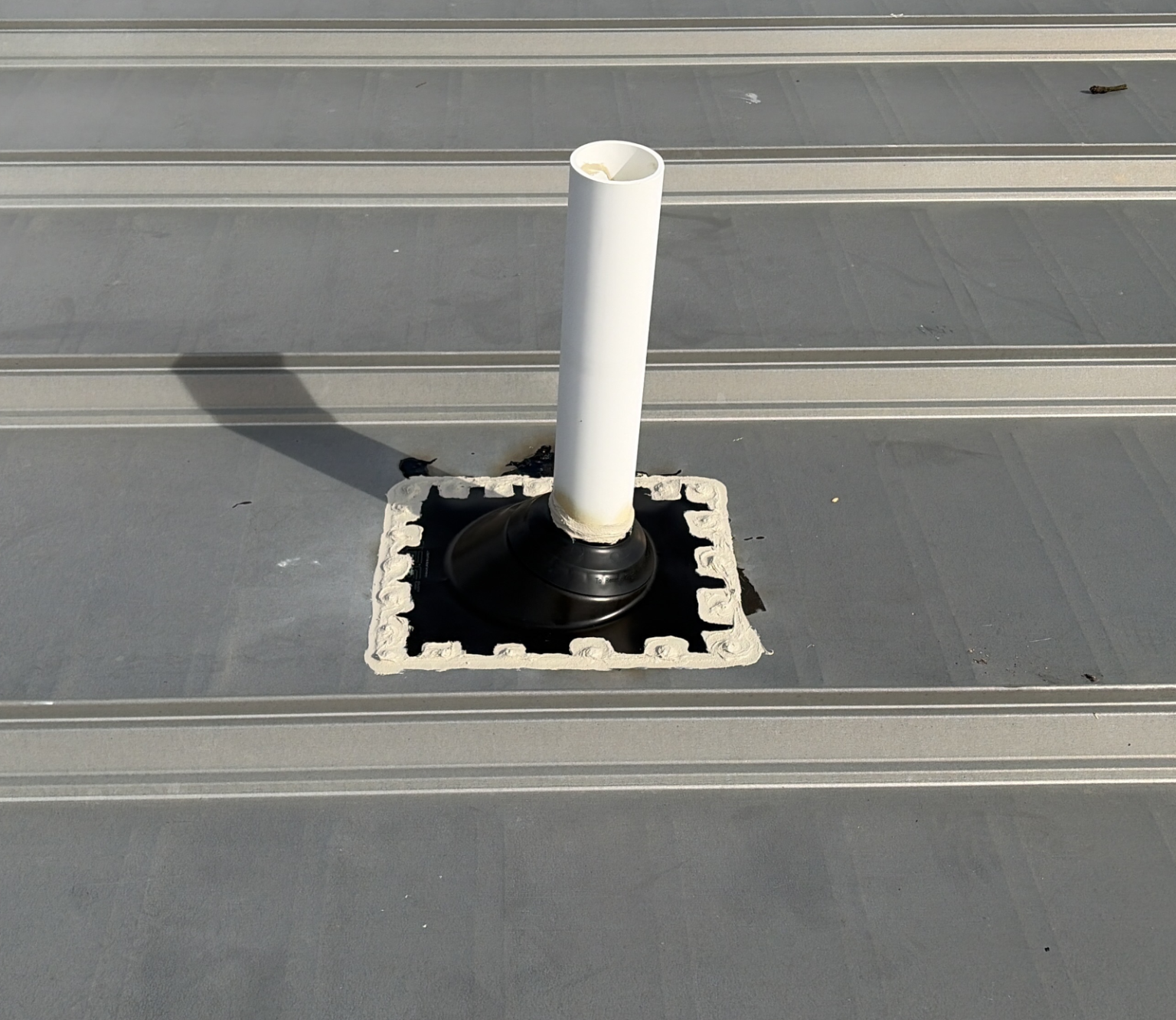 New pipe boot on commercial roof.