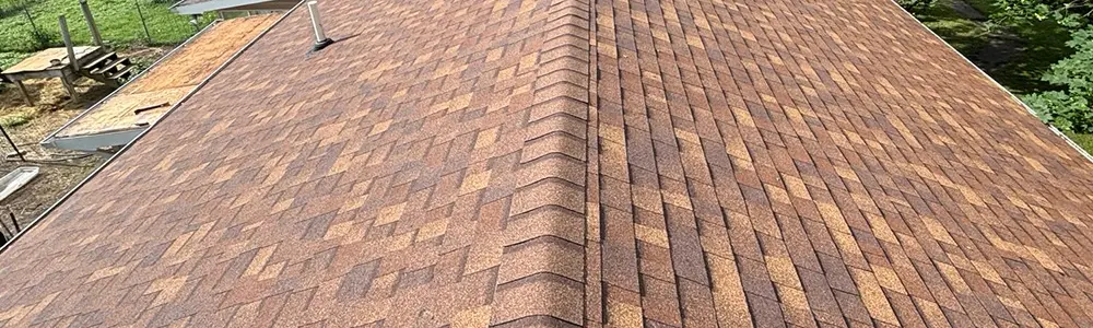 A nice view of a warrantied luxury brown shingle installed by Ideal Roofing, a Flint Michigan roofing contractor after they provided a service for residential roof replacements.